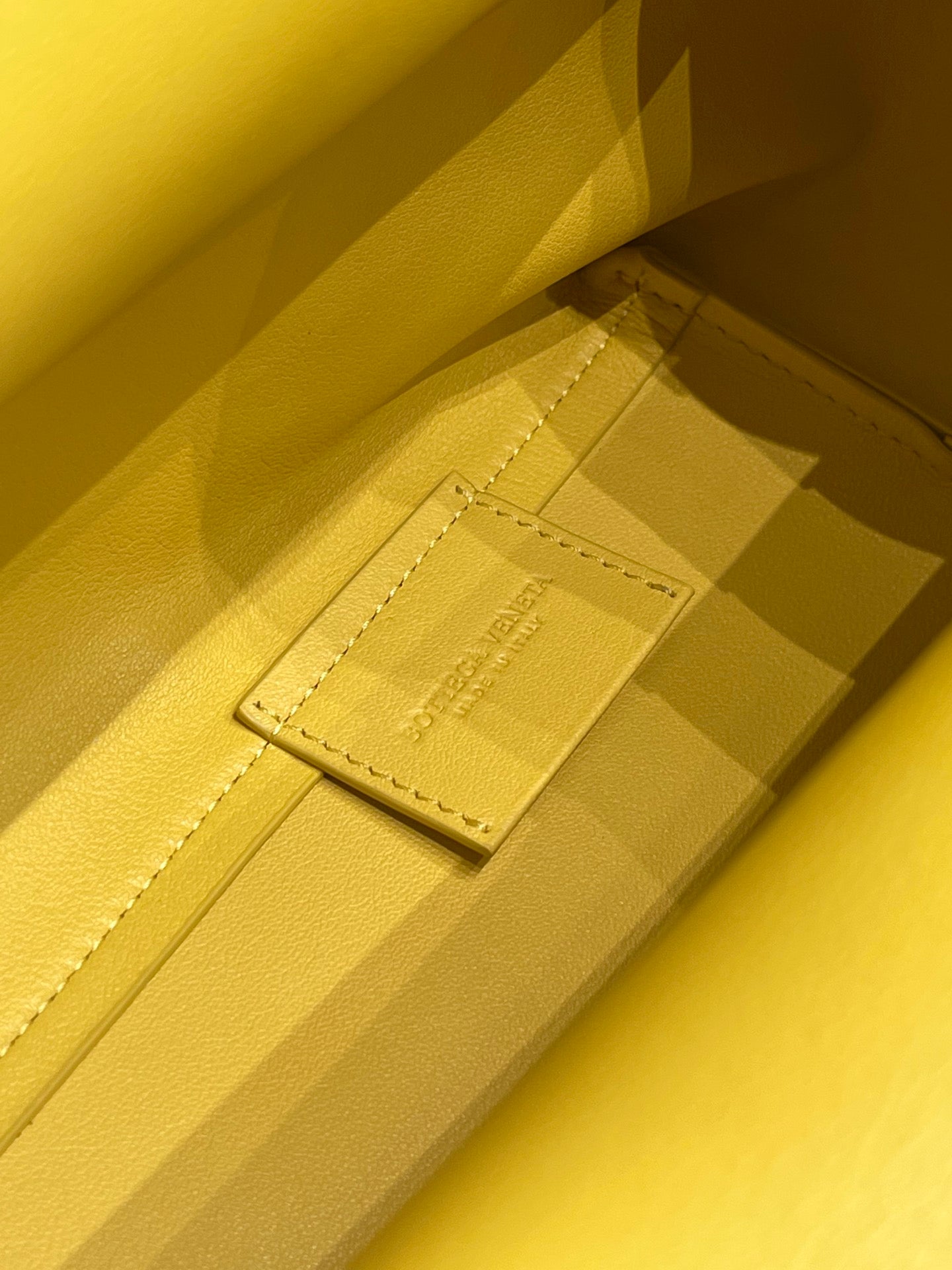 TRIANGLE HANDLE BAG 31 IN DANDELION YELLOW LAMBSKIN