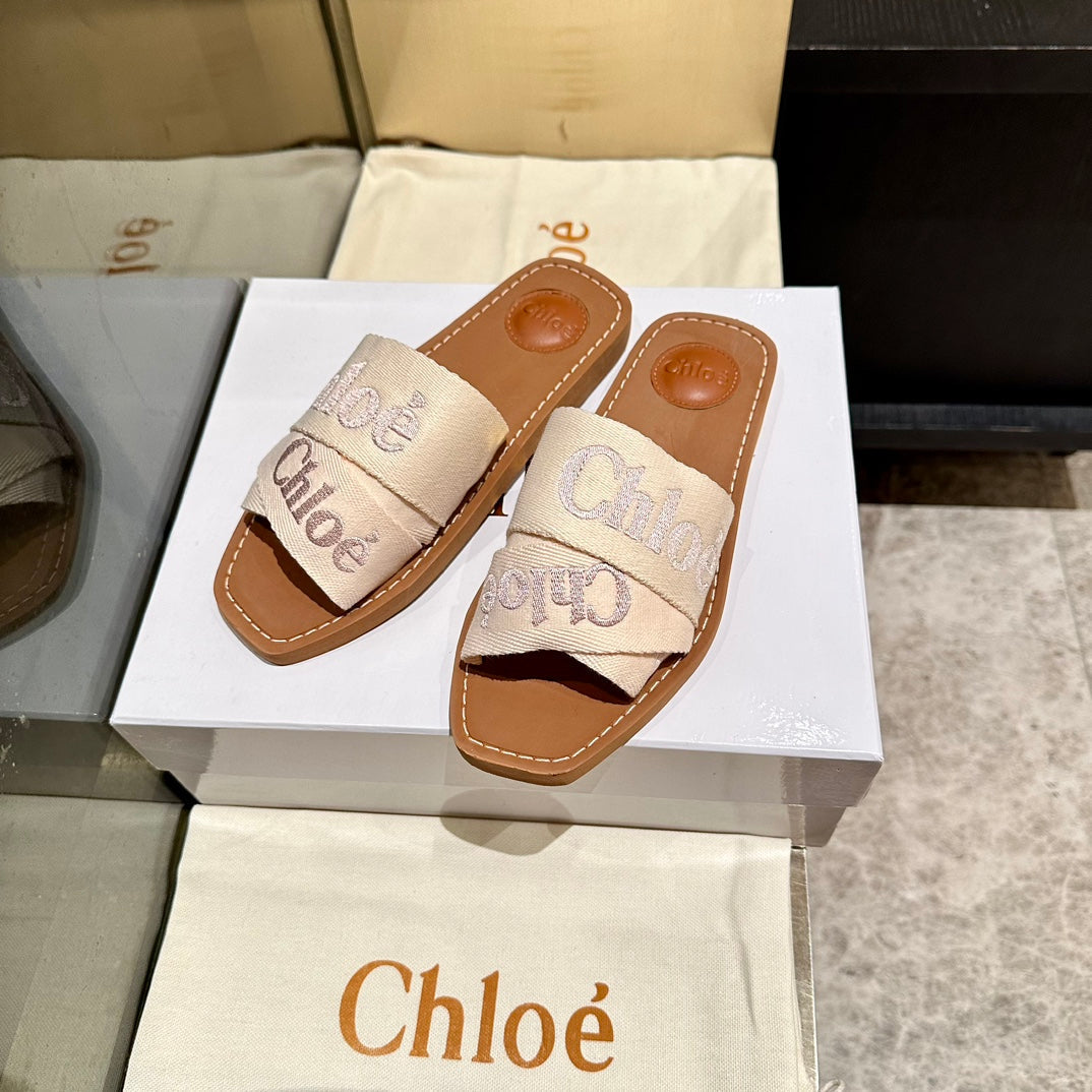WOODY SLIDES IN BEIGE FABRIC WITH EMBROIDERED LOGO STRAPS