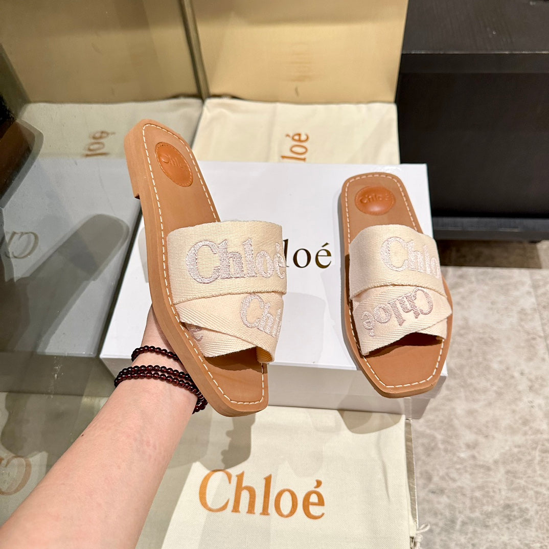 WOODY SLIDES IN BEIGE FABRIC WITH EMBROIDERED LOGO STRAPS