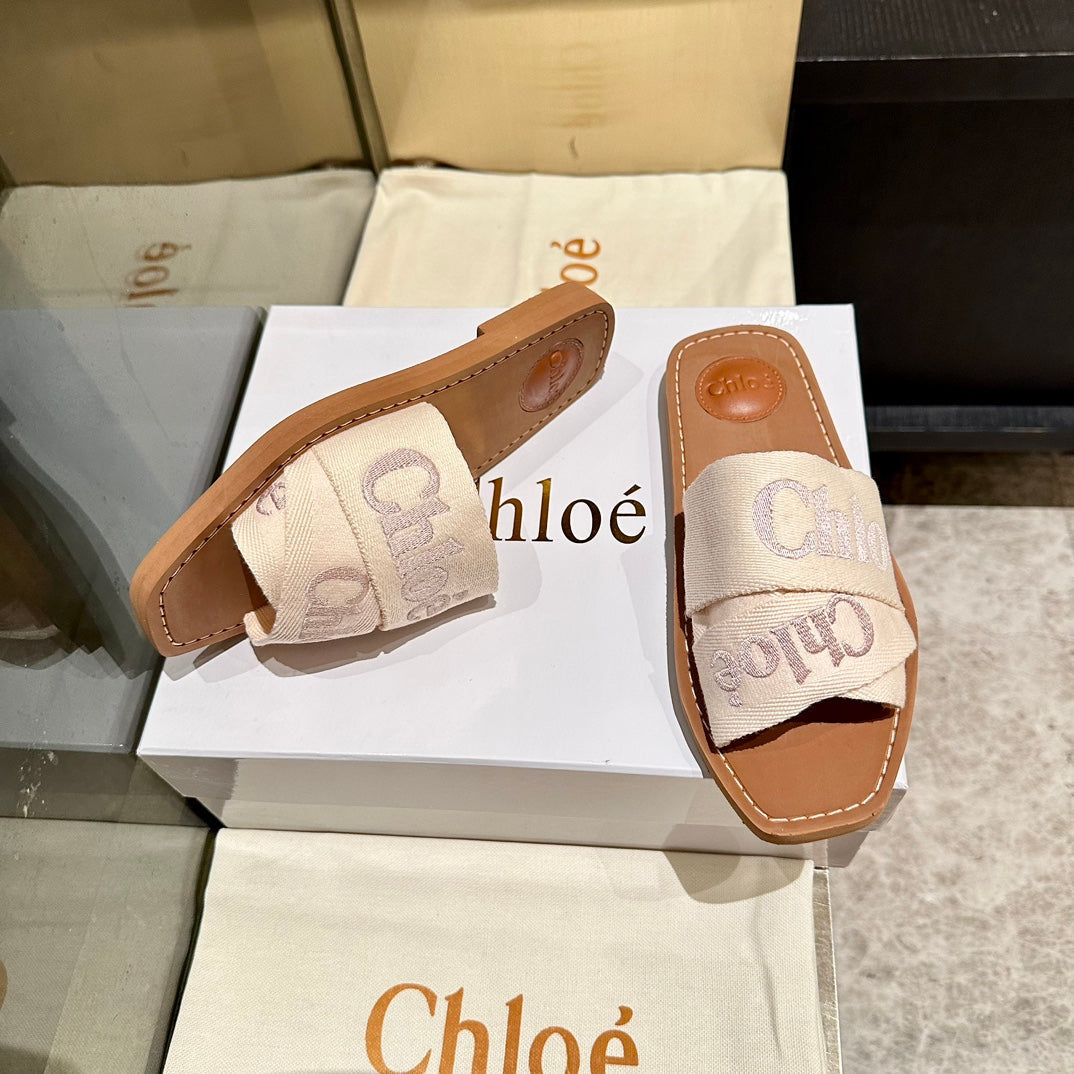 WOODY SLIDES IN BEIGE FABRIC WITH EMBROIDERED LOGO STRAPS