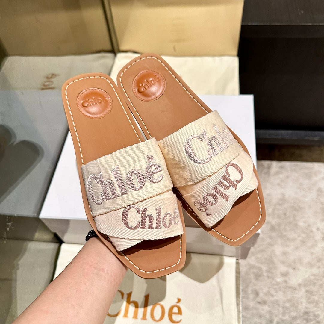 WOODY SLIDES IN BEIGE FABRIC WITH EMBROIDERED LOGO STRAPS