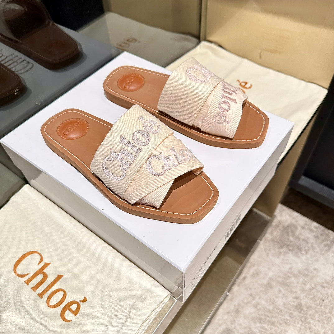 WOODY SLIDES IN BEIGE FABRIC WITH EMBROIDERED LOGO STRAPS