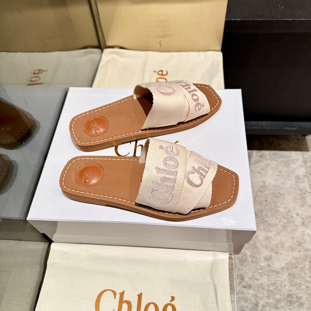 WOODY SLIDES IN BEIGE FABRIC WITH EMBROIDERED LOGO STRAPS