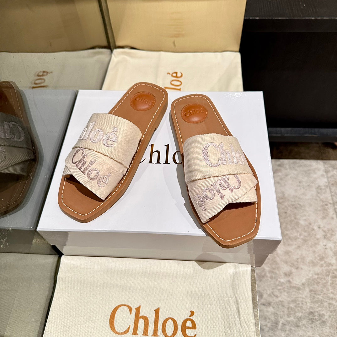 WOODY SLIDES IN BEIGE FABRIC WITH EMBROIDERED LOGO STRAPS