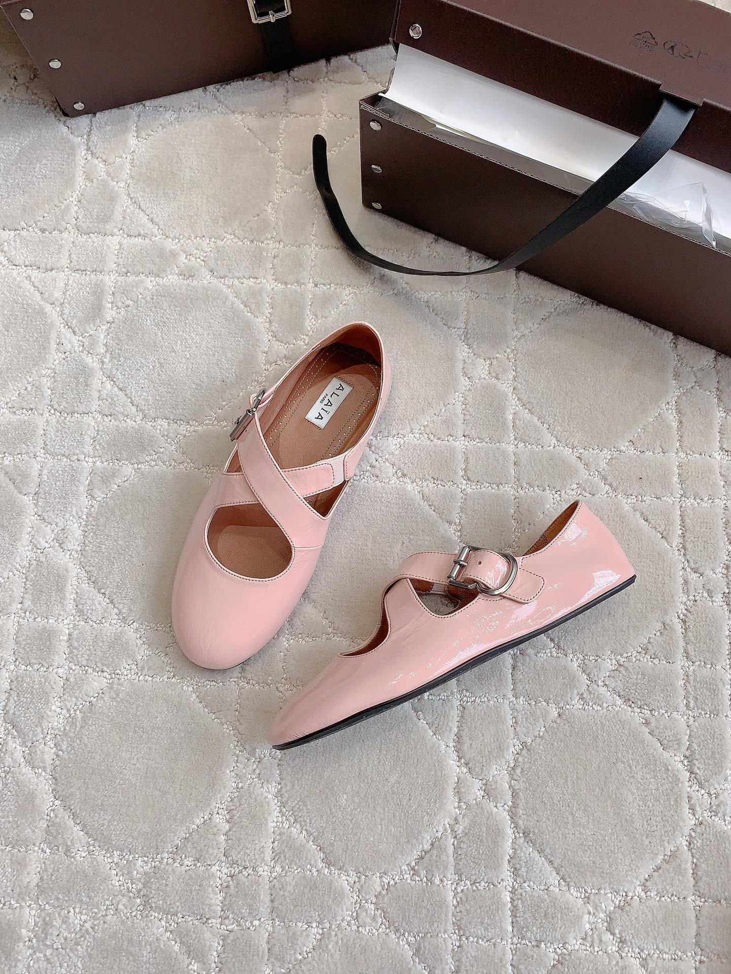 ALAIA CRISS CROSS BALLET FLAT IN BABY PINK LAMBSKIN WITH SILVER HARDWARE