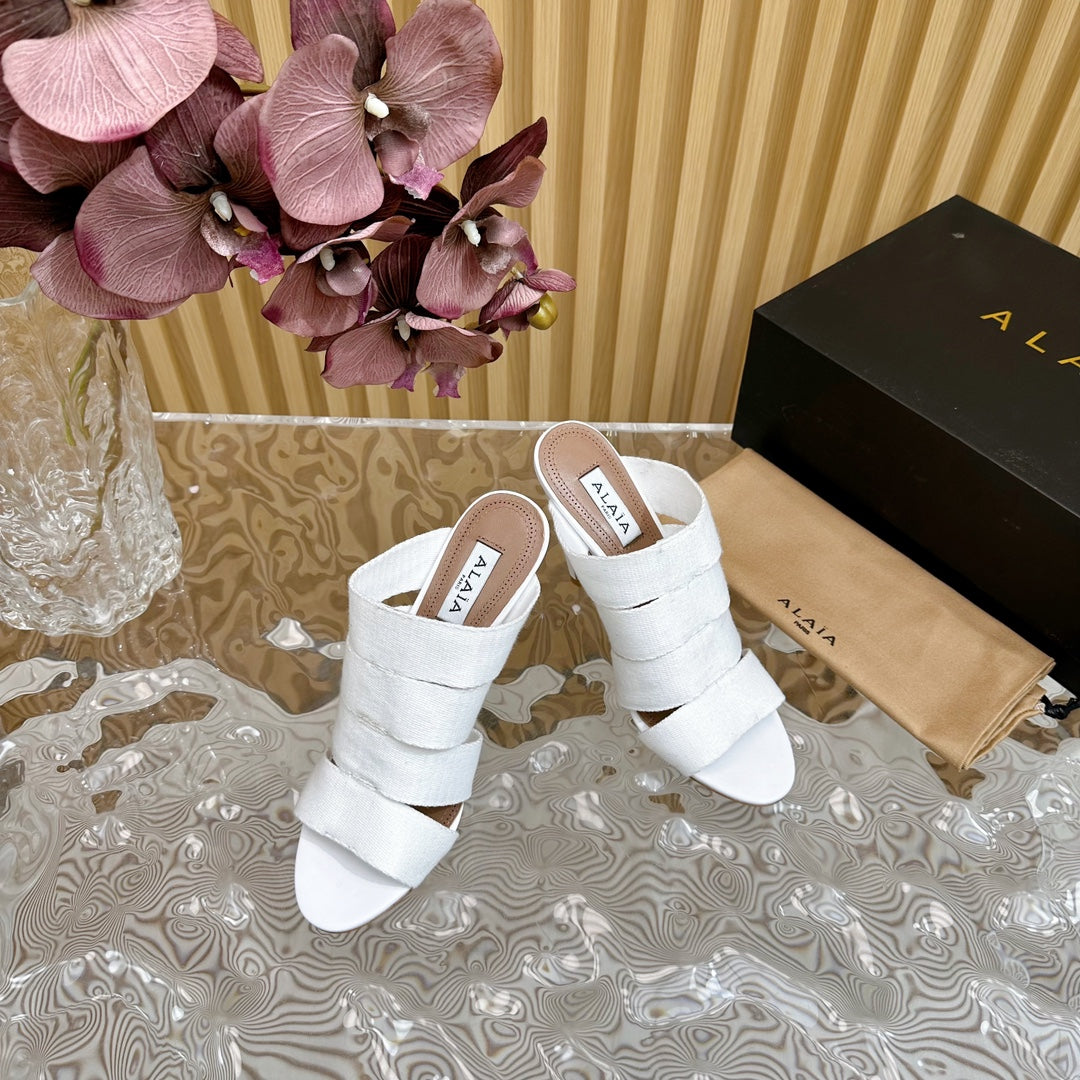 ALAIA ELASTIC CAGE MULE SANDALS IN WHITE WOVEN STRAP AND LAMBSKIN
