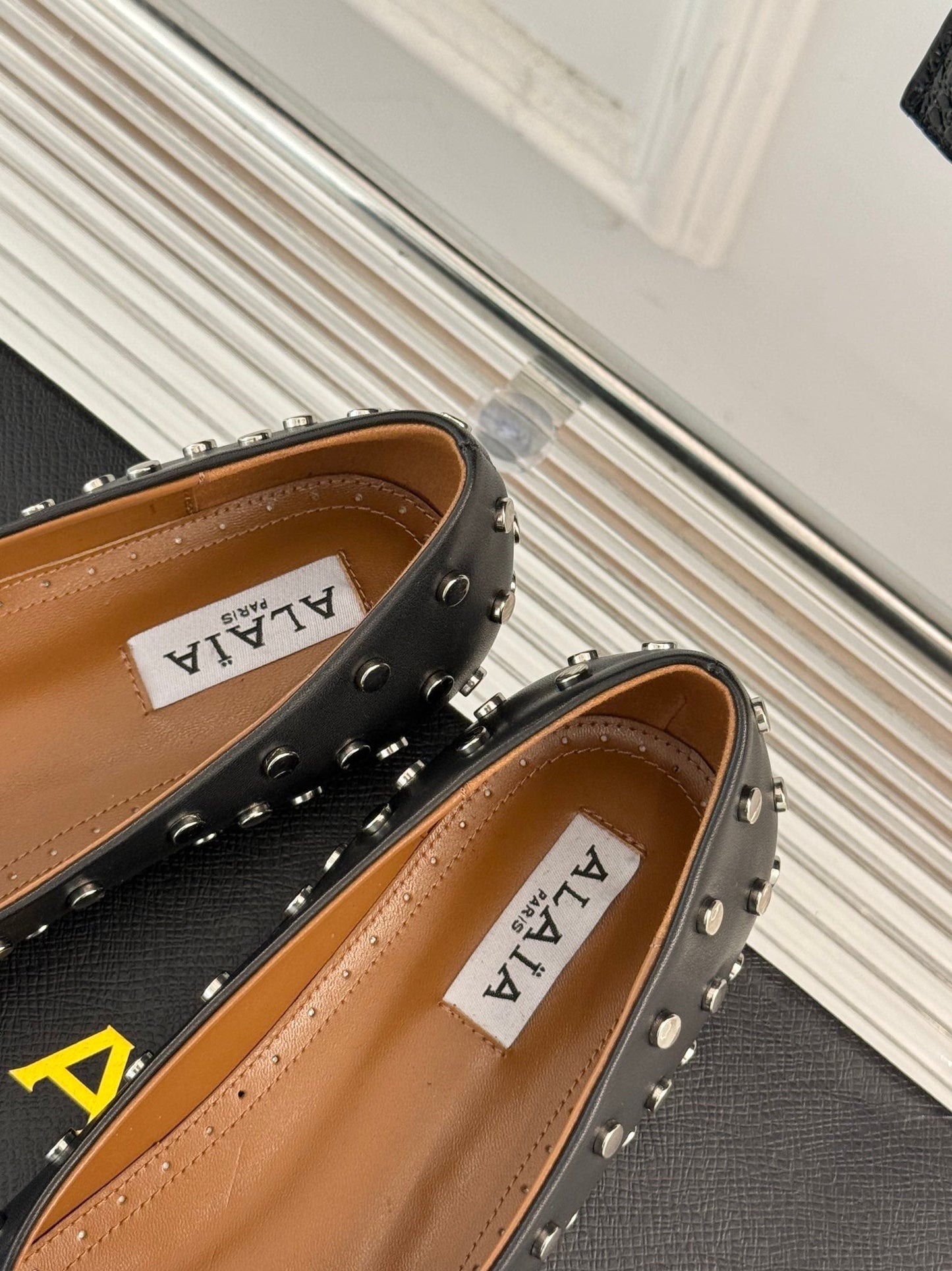 STUD-EMBELLISHED BALLET FLATS IN BLACK CALFSKIN