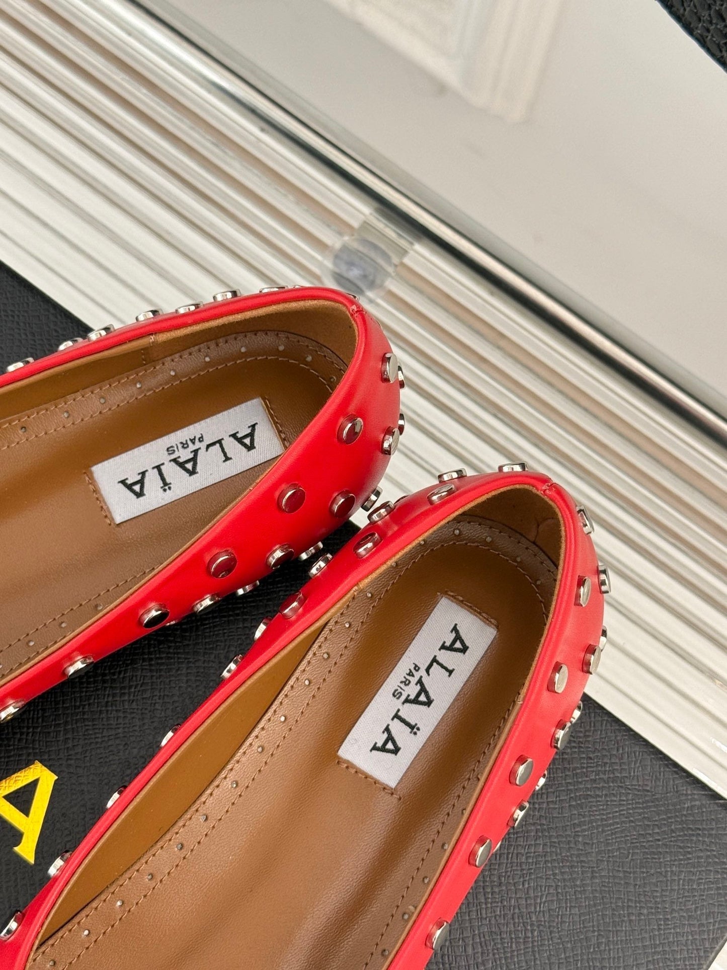 STUD-EMBELLISHED BALLET FLATS IN CHERRY RED CALFSKIN