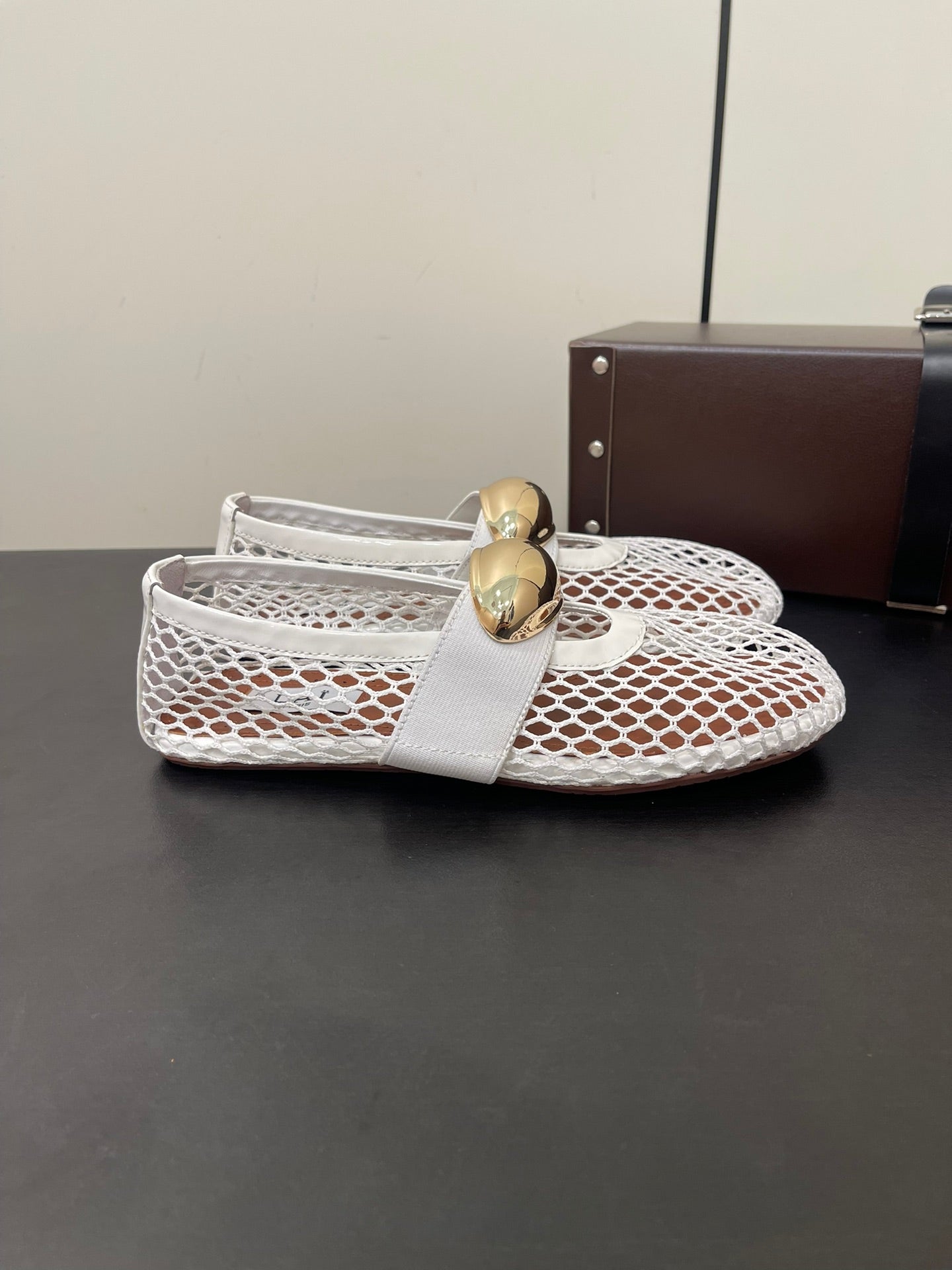 ALAIA BALLET FLATS IN WHITE MESH FISHNET WITH GOLD HARDWARE
