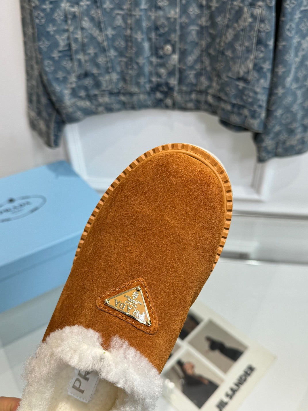 TRIANGLE LOGO MULES IN BRONZE BROWN SUEDE AND SHEARLING LINING