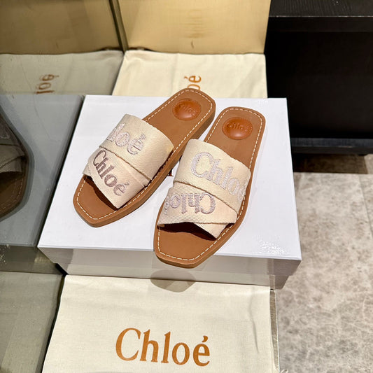 WOODY SLIDES IN BEIGE FABRIC WITH EMBROIDERED LOGO STRAPS