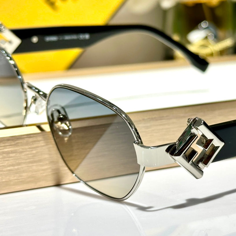 TRAVEL ROUND FRAME SUNGLASSES FE40148l  IN METAL AND ACETATE