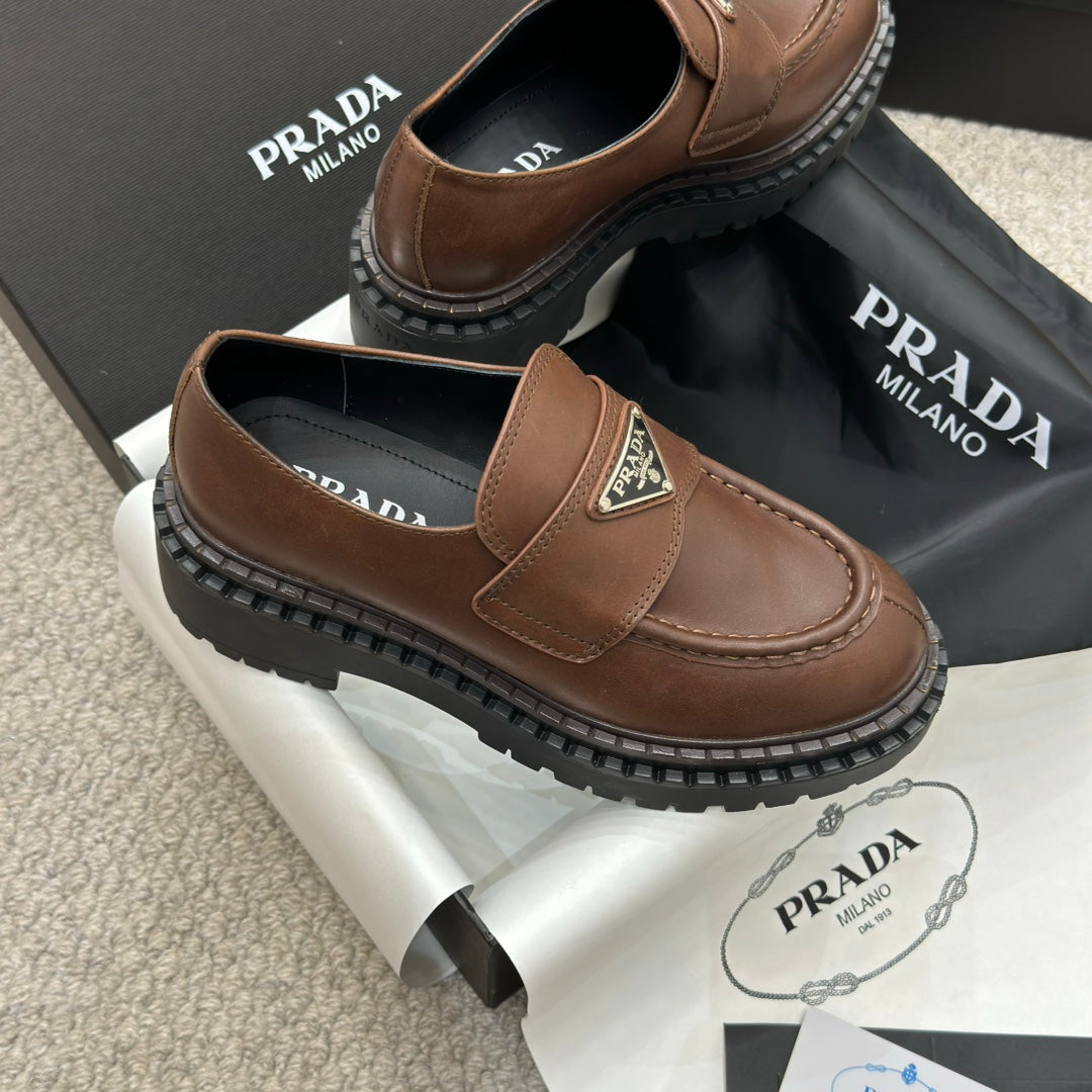 PRADA 25S LOAFER 50MM IN DARK BROWN CALFSKIN LOGO